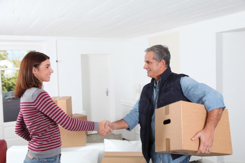Local movers organizing fragile items during a Crayford relocation