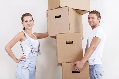 Professional movers loading boxes and furniture for a local move